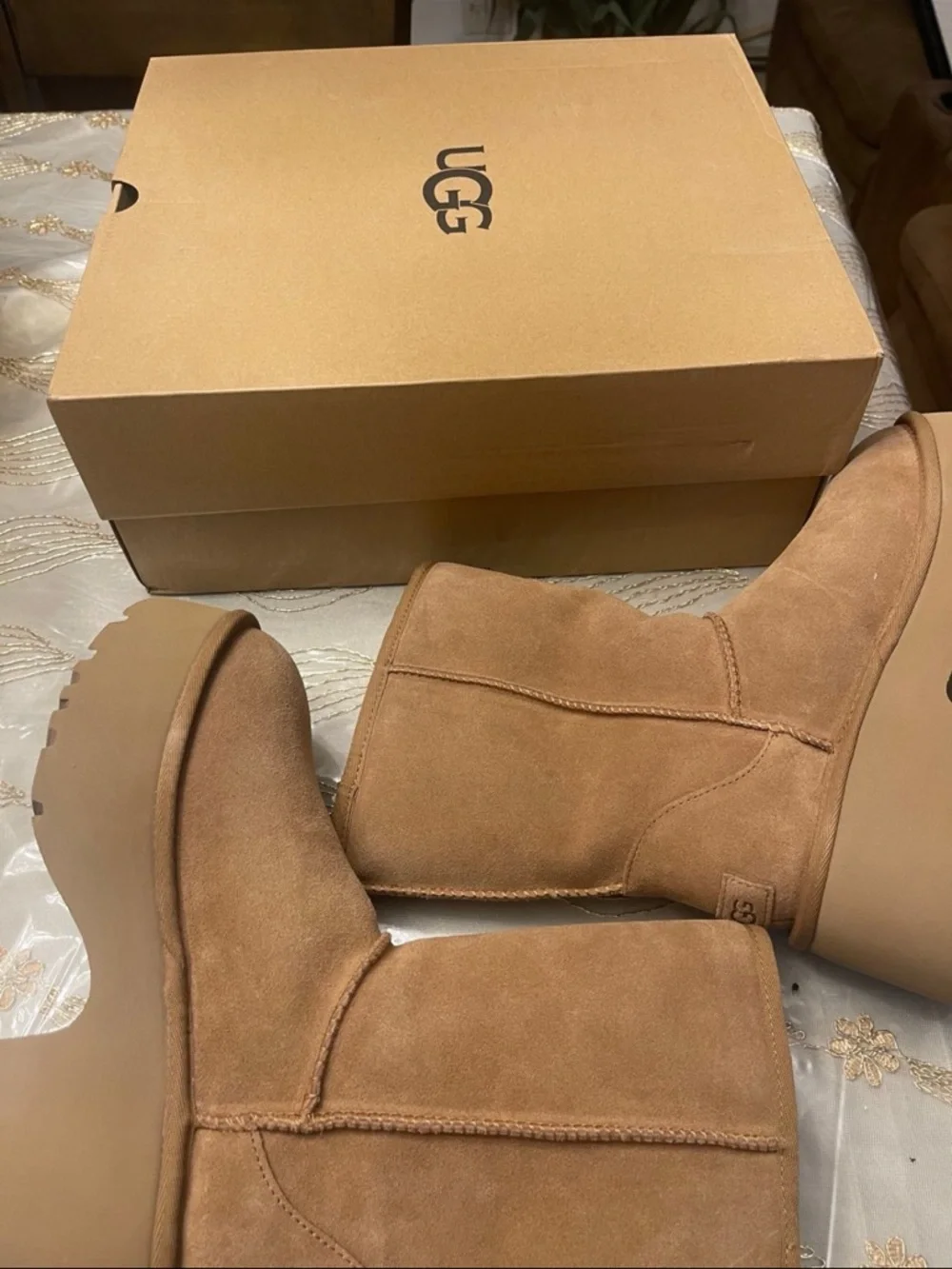 UGG Women's classic short new heights bootie’s size 7